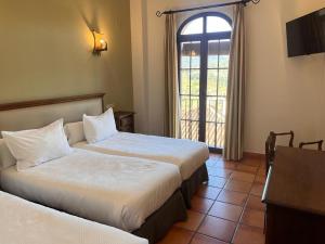 Posteľ alebo postele v izbe v ubytovaní Hotel Sierra de Ubrique + 37 fotografií