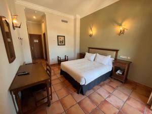 Posteľ alebo postele v izbe v ubytovaní Hotel Sierra de Ubrique
