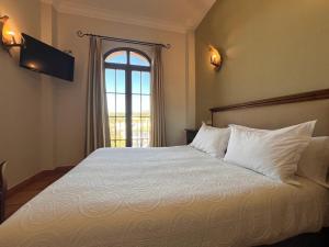 Posteľ alebo postele v izbe v ubytovaní Hotel Sierra de Ubrique