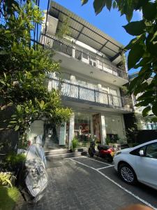 a car parked in a parking lot in front of a building at Hanthana Mount View in Kandy
