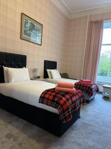 Postel nebo postele na pokoji v ubytování Eliza House