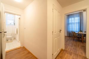 an empty room with a toilet and a table at Resort Červený dvůr in Rapotín