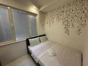 Postel nebo postele na pokoji v ubytování Guest House Central