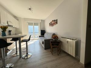 a living room with a couch and a table at Apartment NicoCeli in Châtillon