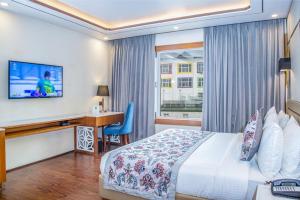 Voodi või voodid majutusasutuse Lemon Tree Hotel Srinagar toas