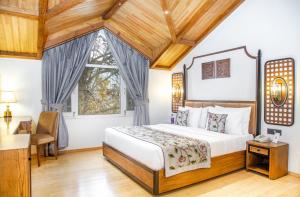 Voodi või voodid majutusasutuse Lemon Tree Hotel Srinagar toas