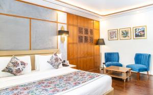Voodi või voodid majutusasutuse Lemon Tree Hotel Srinagar toas