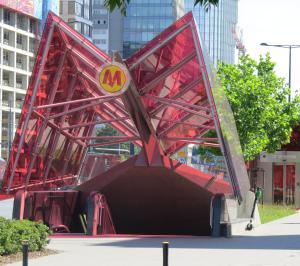 a large red metal structure with a mcdonalds sign on it at Vista Residence Premium II in Warsaw