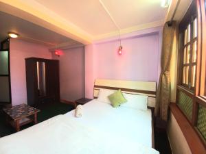 Letto o letti in una camera di Swastik Guest House