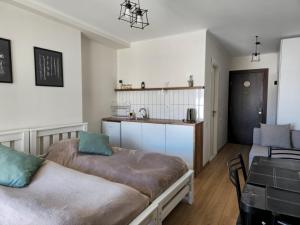 a kitchen with two beds and a sink in a room at Gudauri Vista 6 in Gudauri +15 photos