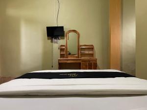 Postel nebo postele na pokoji v ubytování Rinjani Golden