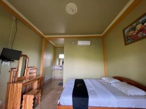 Postel nebo postele na pokoji v ubytování Rinjani Golden