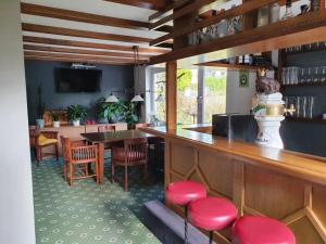 Lounge nebo bar v ubytování Pension Robin Hood