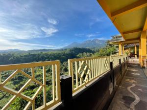 a balcony with a view of the mountains at Rinjani Golden in Senaru