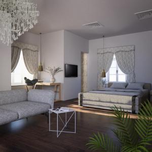 ein Schlafzimmer mit einem Bett, einem Sofa und einem TV in der Unterkunft Heritage Hotel Martinis Marchi in Maslinica
