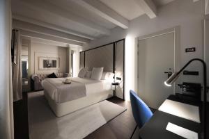 Posteľ alebo postele v izbe v ubytovaní Summum Boutique Hotel, member of Meliá Collection