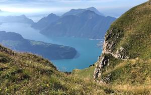 a view of a body of water from a mountain at Muota River & Industry Apartment by Nature Apartments Switzerland in Muotathal