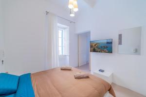 Ένα ή περισσότερα κρεβάτια σε δωμάτιο στο Typical Maltese town house just outside Valletta