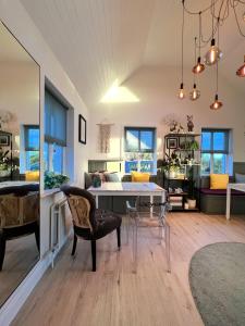 a living room with a table and a couch at Thistledown Lodge in Fethard on Sea