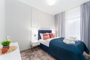 Ένα ή περισσότερα κρεβάτια σε δωμάτιο στο Apartament Błękitny z Basenem Letnim by HolidaySun +27 φωτογραφίες
