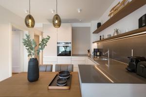 a kitchen with a table with a vase on it at Beachhouse Bansin App 06 in Bansin