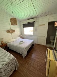 Ένα ή περισσότερα κρεβάτια σε δωμάτιο στο Maré suites