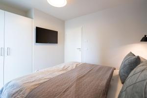 Ein Bett oder Betten in einem Zimmer der Unterkunft Domizil Meerzeit, App. 7
