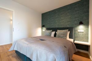 Ein Bett oder Betten in einem Zimmer der Unterkunft Domizil Meerzeit, App. 7