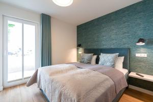 Ein Bett oder Betten in einem Zimmer der Unterkunft Domizil Meerzeit, App. 7