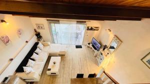 an overhead view of a living room with a couch at Appartement Boug 2 Lumio in Lumio