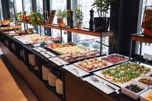 a buffet line with many different types of food at Dune Beach Resort - C in Mielno