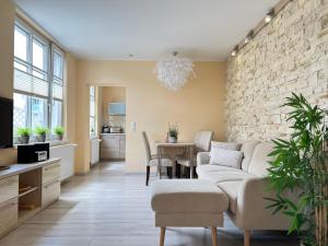 a living room with a couch and a table at Villa Trautes Heim in Ahlbeck