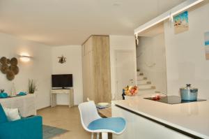 TV a/nebo společenská místnost v ubytování L' Alba del Salento