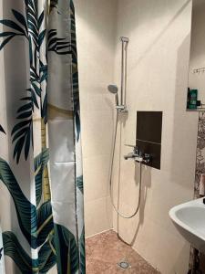 a bathroom with a shower and a sink at Apartment with Sea View in Varna City