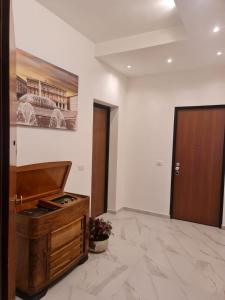 a room with a wooden altar and a door at ATTICO GENOVA con POSTO AUTO in Genova