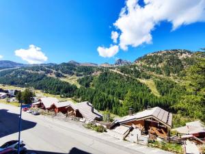 an aerial view of a village with mountains in the background at Appartement cosy proche pistes avec parking - FR-1-292-195 in Isola