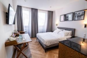 Postel nebo postele na pokoji v ubytování Vienna Lights Apartments - Domenig by Kent