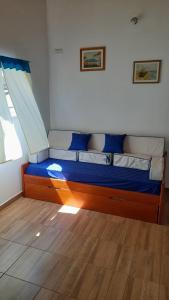 Una cama o camas en una habitación de La Familia