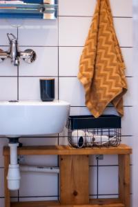 a bathroom with a sink and a towel at Domki na Widoku in Lubomierz +100 photos
