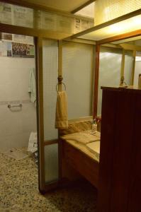 a bathroom with a sink and a mirror at 3B Habitación SUR con baño privado y AC in Salto