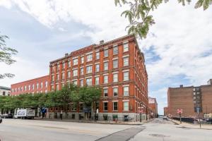 a large red brick building on a city street at Serenity & Ultimate Airjet Relaxation Retreat in Cleveland