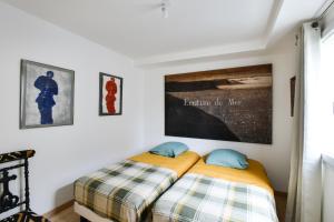 Postel nebo postele na pokoji v ubytování Cajan - Appt à 100m de la plage