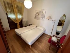 A bed or beds in a room at Giuse