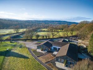 an aerial view of a house with a farm at Suite 7 - Sleeping Giant Hotel - Pen Y Cae Inn in Brecon