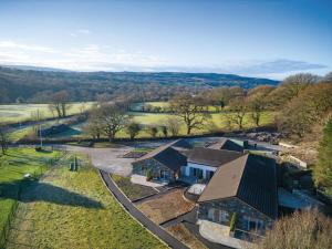 an aerial view of a house with a farm at Suite 6 - Sleeping Giant Hotel - Pen Y Cae Inn in Brecon +16 photos