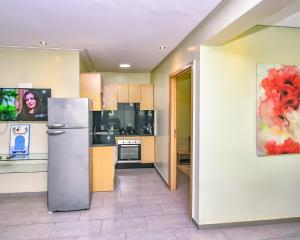 Kuchyň nebo kuchyňský kout v ubytování Cozy Central - Gym & Spa Srvcs