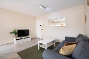 Televízia a/alebo spoločenská miestnosť v ubytovaní White Sea by Seasidehomes
