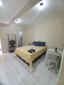 Tempat tidur dalam kamar di Pousada Claiô Suíte estrela