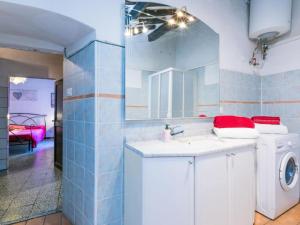a bathroom with a washing machine and a sink at Casa Zia Seconda in Montecatini Val di Cecina