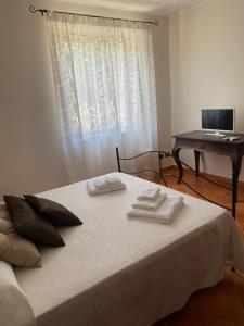 Postel nebo postele na pokoji v ubytování Baglio Quadrone Torre Salsa